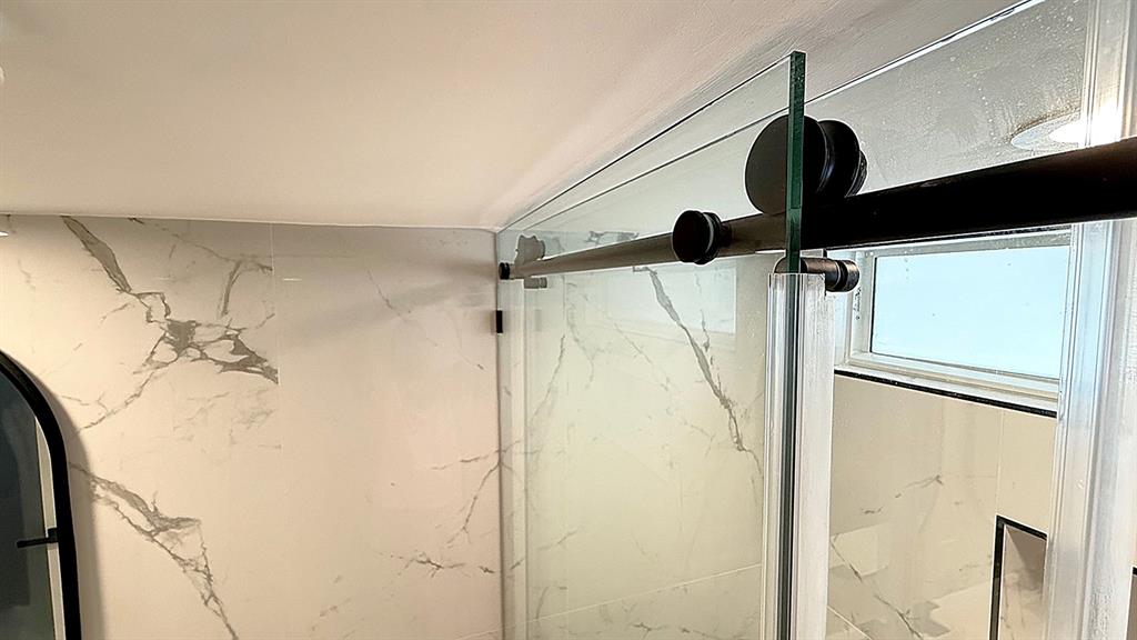 10 Southeast 13th Street, Unit B3 Boca Raton, FL 33432 - Photo 32 of 85 a bathroom with a shower and a glass door