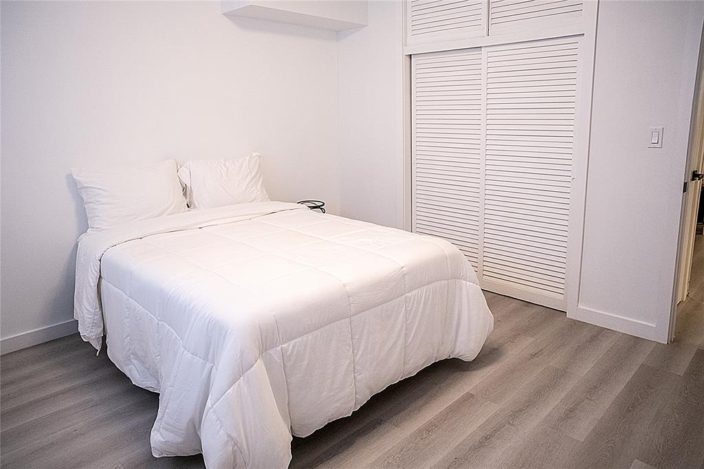 10 Southeast 13th Street, Unit B3 Boca Raton, FL 33432 - Photo 37 of 85 a bedroom with a bed and a window