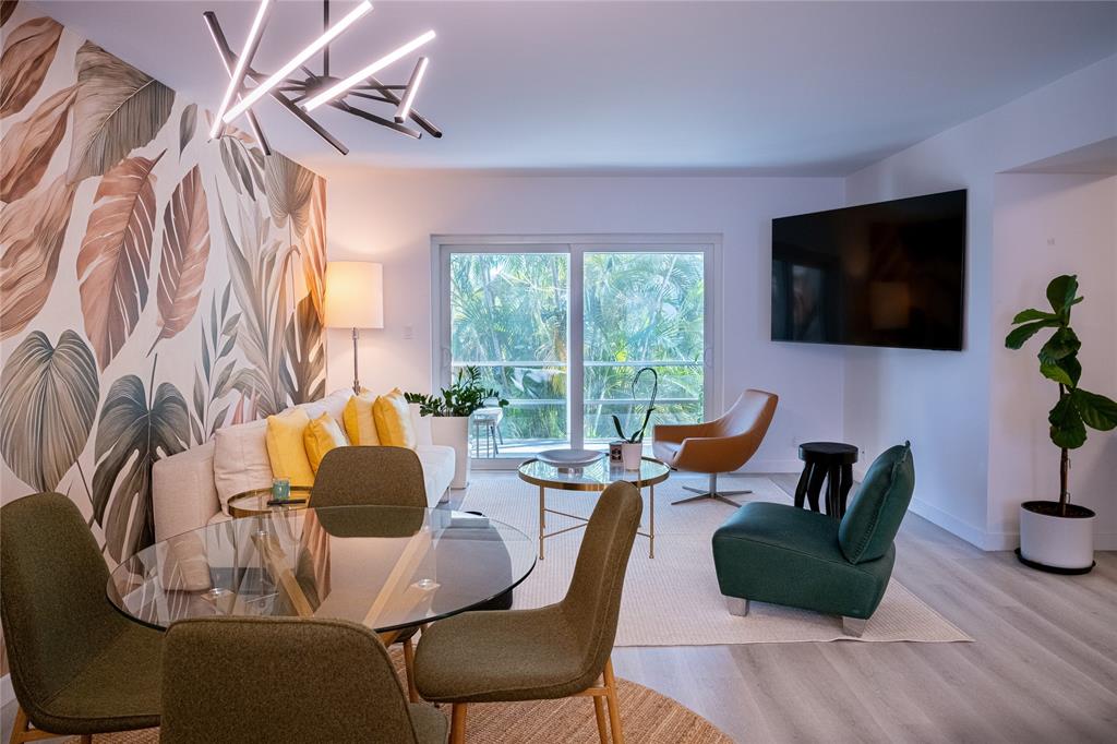 10 Southeast 13th Street, Unit B3 Boca Raton, FL 33432 - Photo 4 of 85 a living room with furniture and a flat screen tv