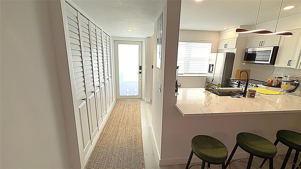 10 Southeast 13th Street, Unit B3 Boca Raton, FL 33432 - Photo 52 of 85 a bathroom with a sink and a mirror