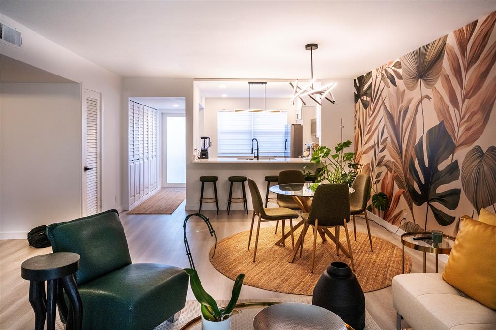 10 Southeast 13th Street, Unit B3 Boca Raton, FL 33432 - Photo 54 of 85 a living room with furniture a window and a chandelier