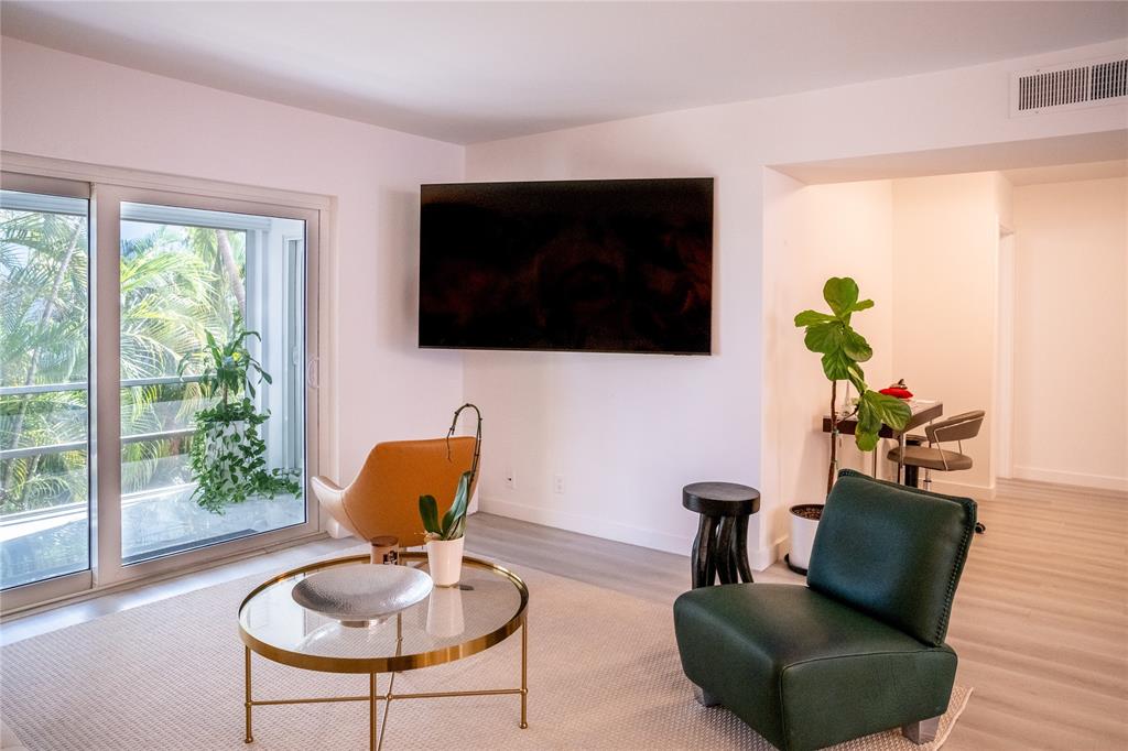 10 Southeast 13th Street, Unit B3 Boca Raton, FL 33432 - Photo 6 of 85 a living room with furniture fireplace and a flat screen tv