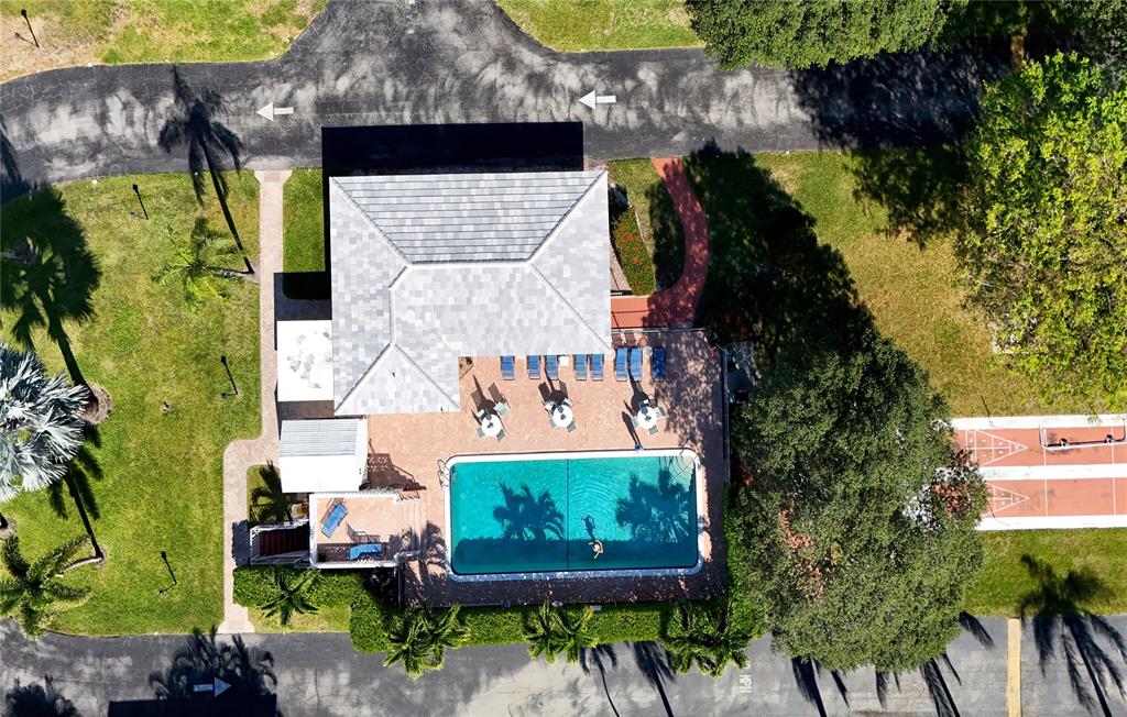 10 Southeast 13th Street, Unit B3 Boca Raton, FL 33432 - Photo 67 of 85 an aerial view of a fireplace with table and chairs