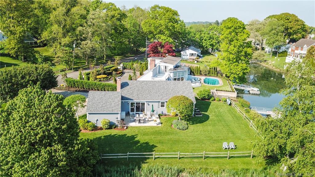 an aerial view of residential house with outdoor space and swimming pool