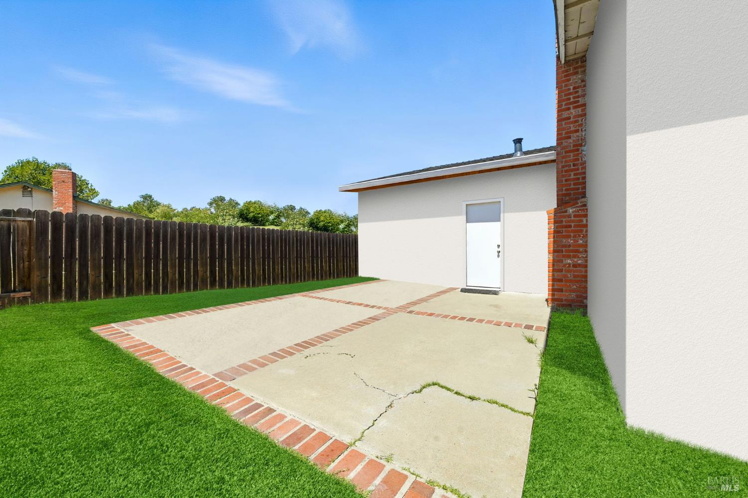 4272 Brentwood Circle Concord, CA 94521 - Photo 27 of 33 a white house with a small yard and wooden fence