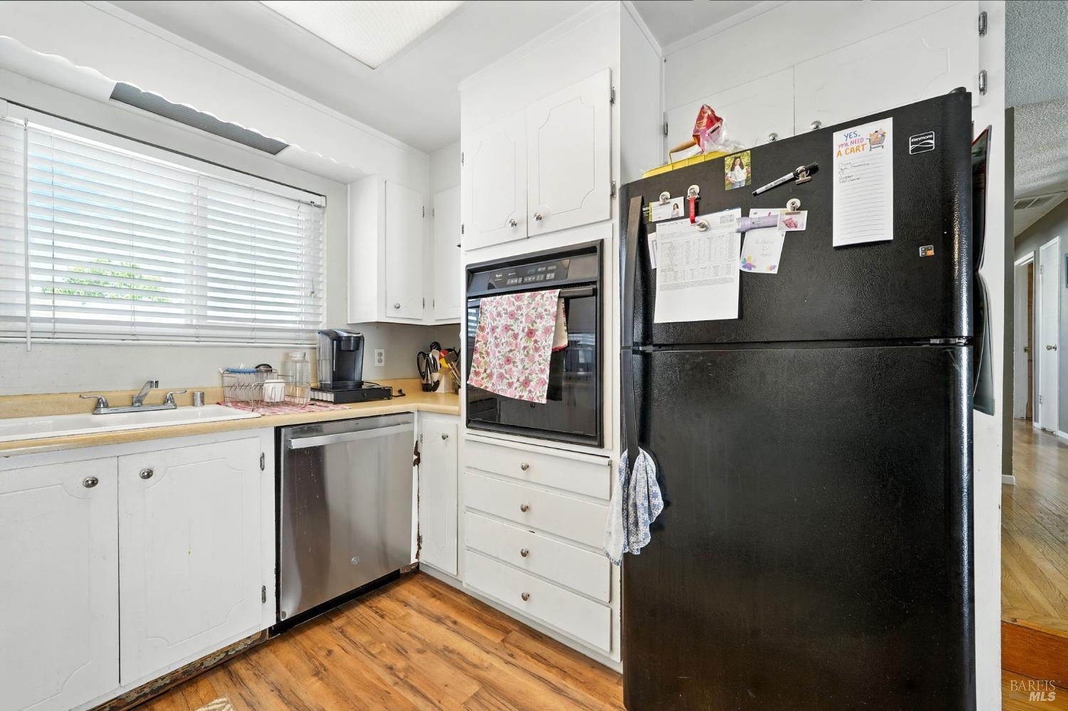 4272 Brentwood Circle Concord, CA 94521 - Photo 9 of 33 a kitchen with stainless steel appliances a refrigerator sink and cabinets