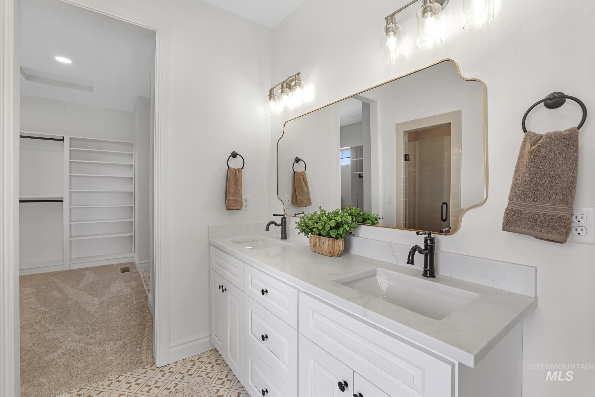 866 Quartz Road Kimberly, ID 83341 - Photo 22 of 48 Double vanity with light-toned countertops and undermount sinks