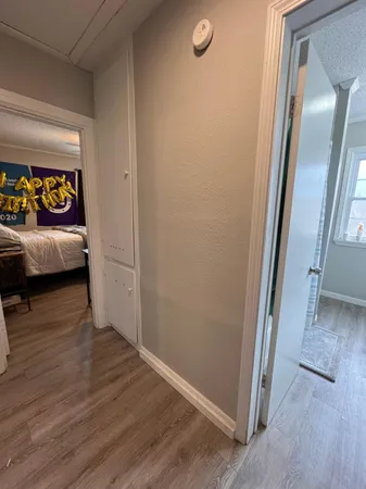 an entryway with a hardwood floor