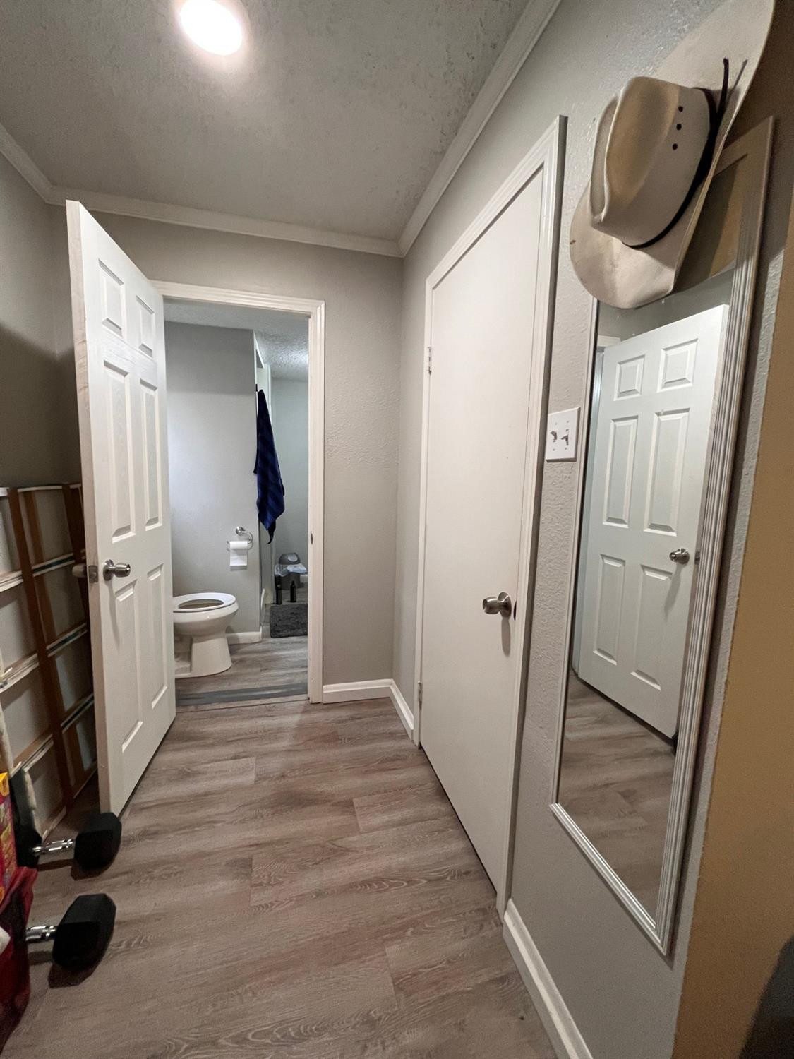 2613 25th Street, Unit FRONT Lubbock, TX 79410 - Photo 15 of 18 a view of a hallway with wooden floor and stairs