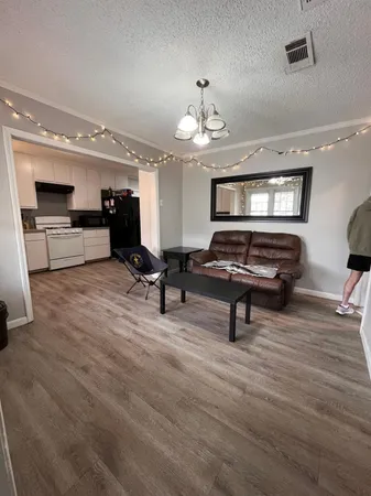 a view of a room with gym equipment and a window