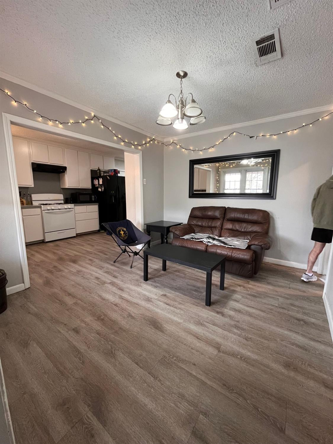 2613 25th Street, Unit FRONT Lubbock, TX 79410 - Photo 3 of 18 a view of a room with gym equipment and a window
