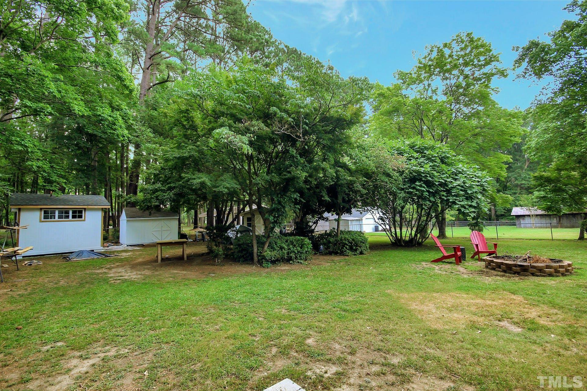 5913 Meadowbrook Road Raleigh, NC 27603 - Photo 24 of 24 a view of a tree in front of a house