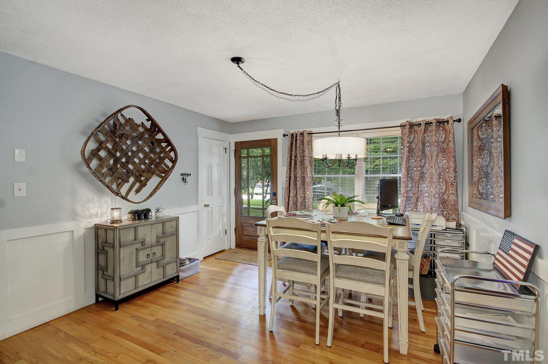 5913 Meadowbrook Road Raleigh, NC 27603 - Photo 7 of 24 a view of a dining room with furniture window and outside view