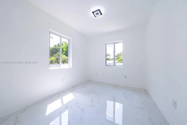 an empty room with windows