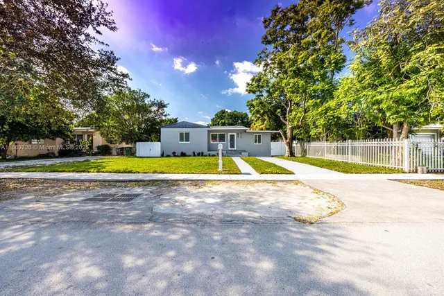 a view of a swimming pool and a yard