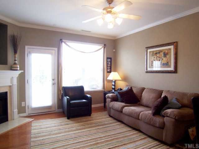 Another view of the Living Rm shows the corner FP and door to the Patio - great for grilling & entertaining!