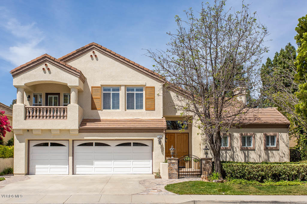 11245 Bentcreek Road Moorpark, CA 93021 - Photo 1 of 48 a front view of a house with a yard