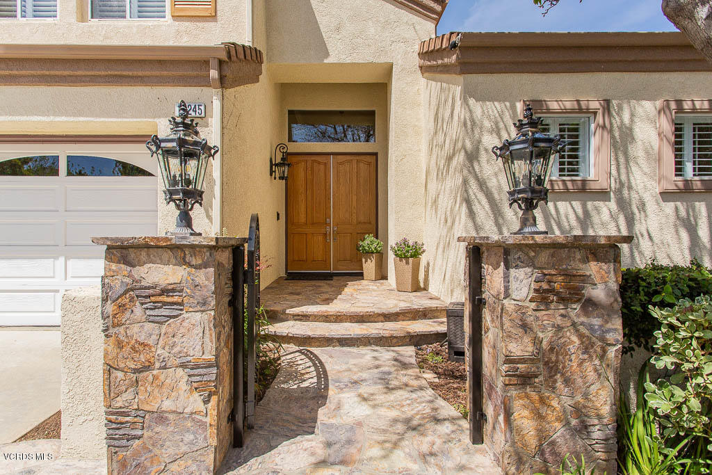 11245 Bentcreek Road Moorpark, CA 93021 - Photo 2 of 48 a front view of a house with many windows