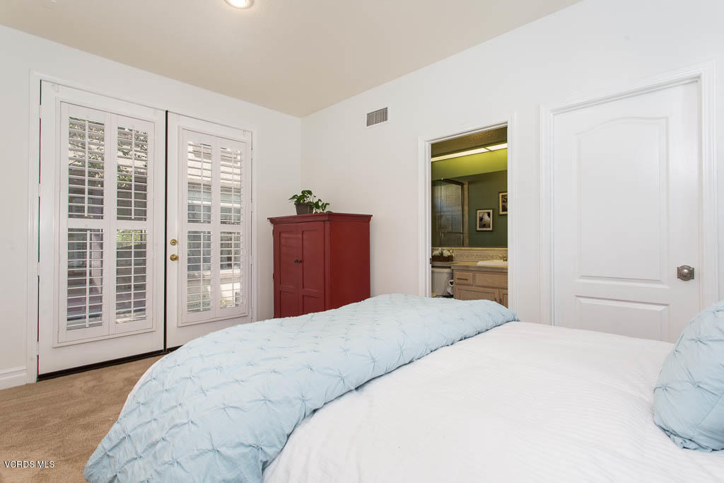 11245 Bentcreek Road Moorpark, CA 93021 - Photo 13 of 48 a bedroom with a large bed and a dresser