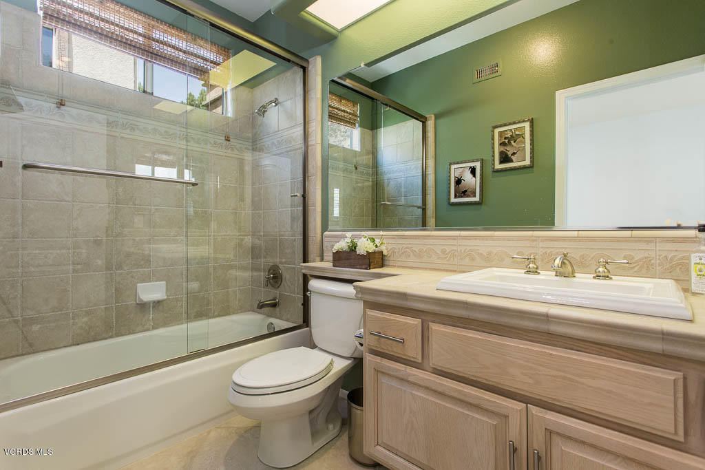 11245 Bentcreek Road Moorpark, CA 93021 - Photo 14 of 48 a bathroom with a sink a toilet and shower