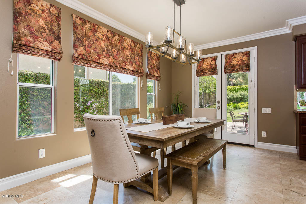 11245 Bentcreek Road Moorpark, CA 93021 - Photo 20 of 48 a dining room with furniture a chandelier and wooden floor