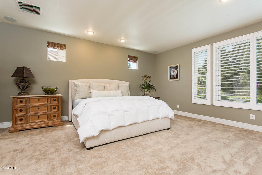 11245 Bentcreek Road Moorpark, CA 93021 - Photo 28 of 48 a bedroom with a bed and a window