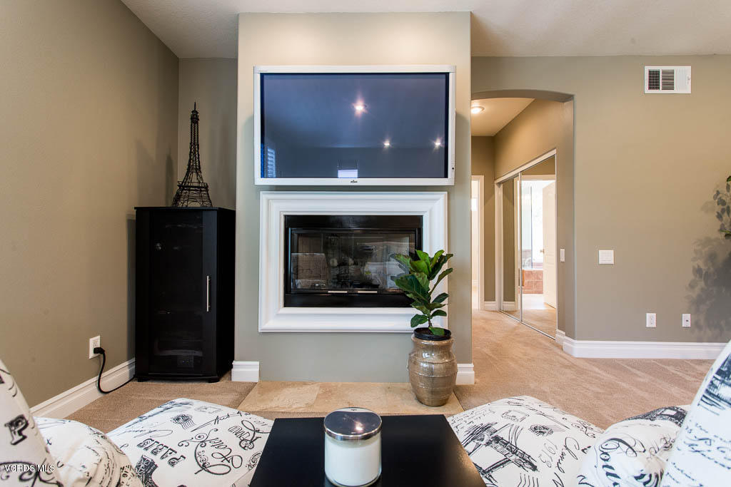 11245 Bentcreek Road Moorpark, CA 93021 - Photo 29 of 48 a living room with furniture and a fireplace