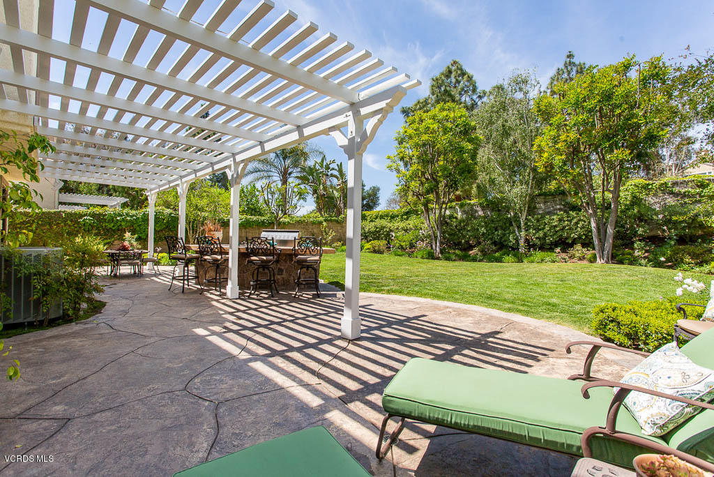 11245 Bentcreek Road Moorpark, CA 93021 - Photo 38 of 48 a view of a patio with a table chairs and a backyard