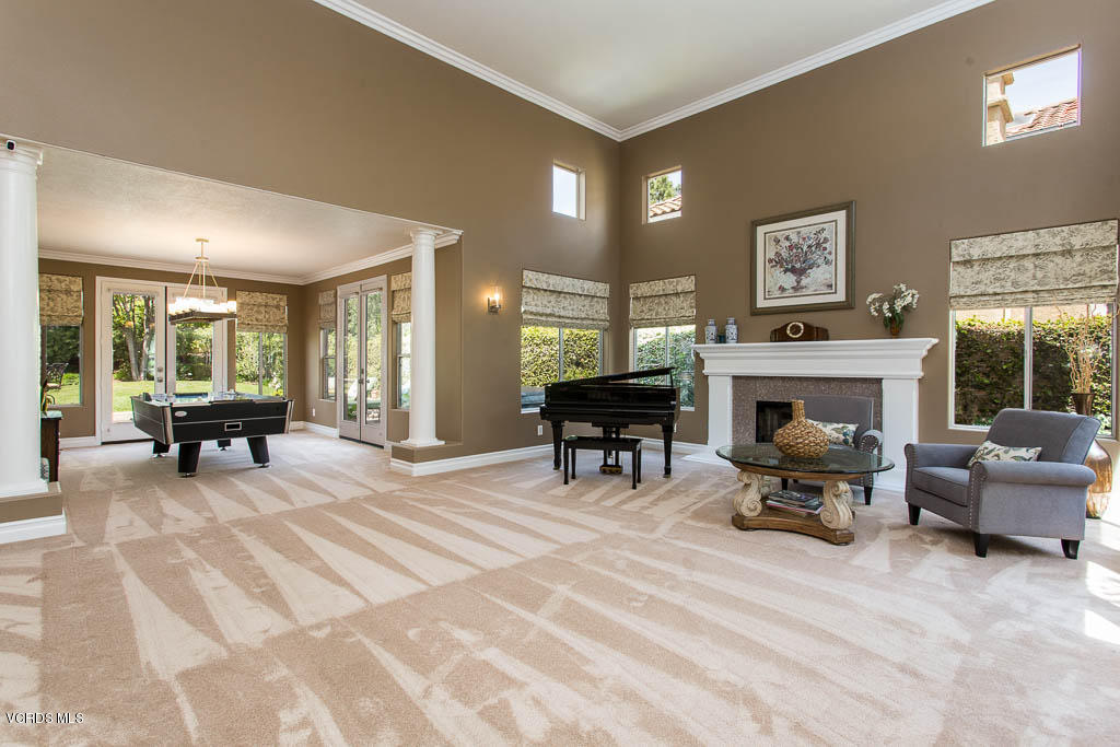 11245 Bentcreek Road Moorpark, CA 93021 - Photo 5 of 48 a living room with furniture a piano and a fireplace