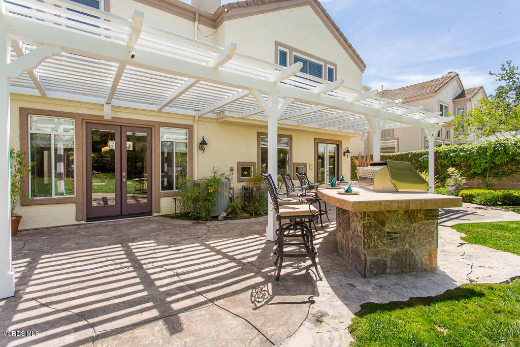 11245 Bentcreek Road Moorpark, CA 93021 - Photo 41 of 48 a view of a patio with dining table and chairs