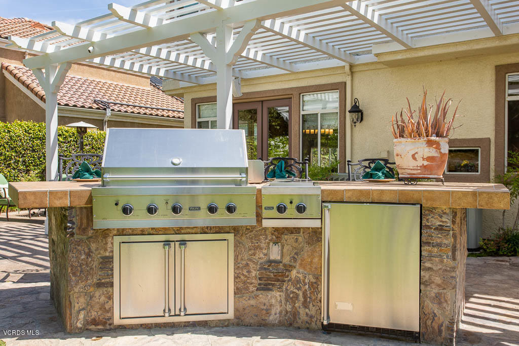 11245 Bentcreek Road Moorpark, CA 93021 - Photo 42 of 48 a kitchen with a stove and a microwave oven