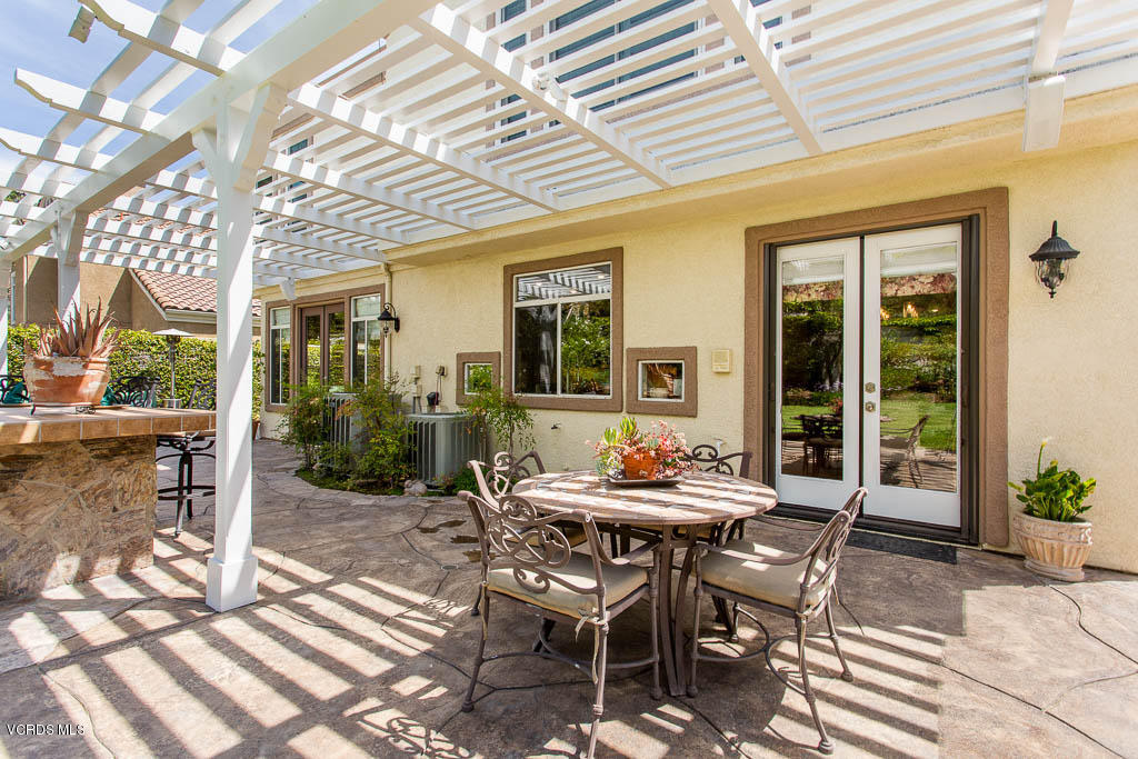 11245 Bentcreek Road Moorpark, CA 93021 - Photo 43 of 48 a view of a patio with a table and chairs and potted plants