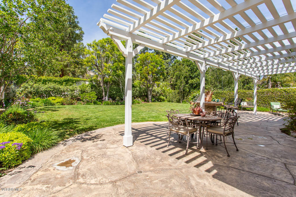 11245 Bentcreek Road Moorpark, CA 93021 - Photo 44 of 48 a view of a patio with a table chairs and backyard