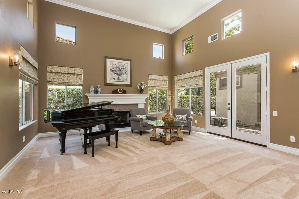 11245 Bentcreek Road Moorpark, CA 93021 - Photo 7 of 48 a living room with furniture a rug and a large window