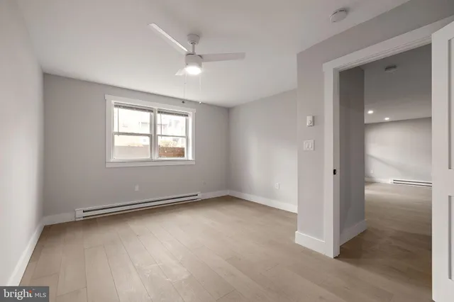 a view of an empty room with a window