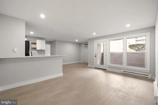 a view of an empty room with a window