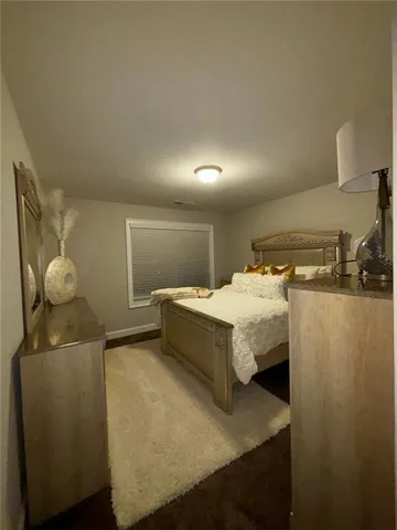 a bed room with a bed and furniture