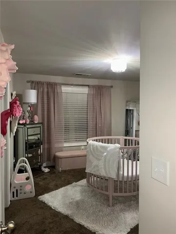 a bedroom with furniture and a window