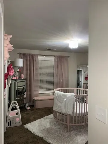 a bedroom with furniture and a window