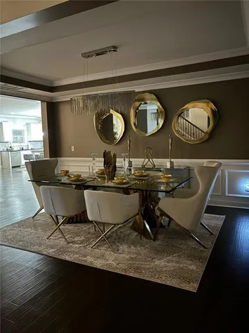 a room with table and chairs