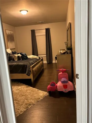 a bedroom with bed and a window