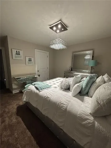 a bedroom with a bed and ceiling fan