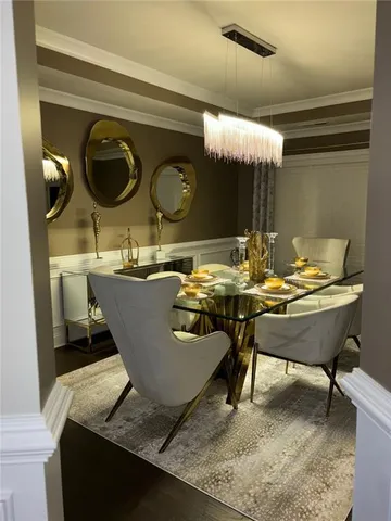 a living room with chairs and a table