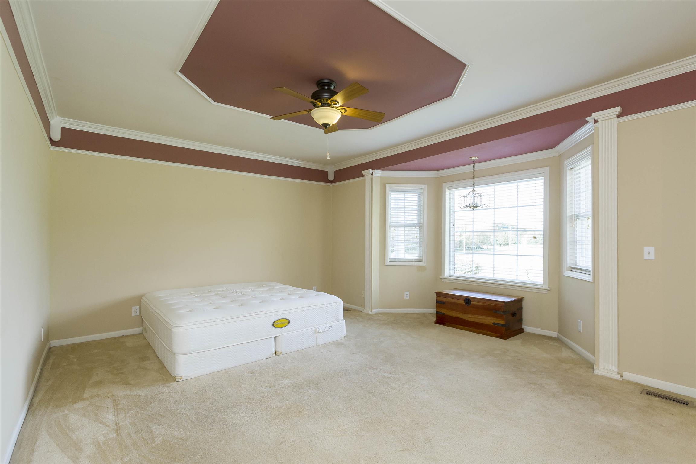 5067 Youngville Road Springfield, TN 37172 - Photo 16 of 28 a bedroom with a bed and a chandelier