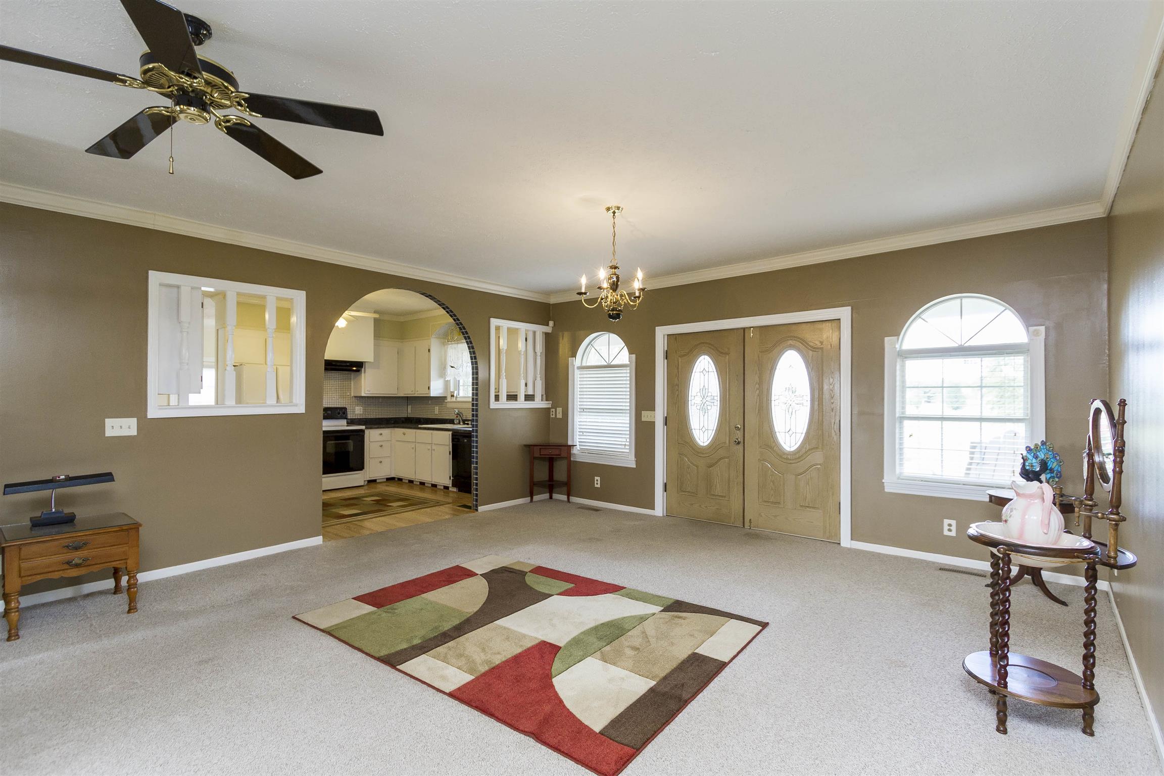 5067 Youngville Road Springfield, TN 37172 - Photo 2 of 28 a living room with furniture a window and gym equipment