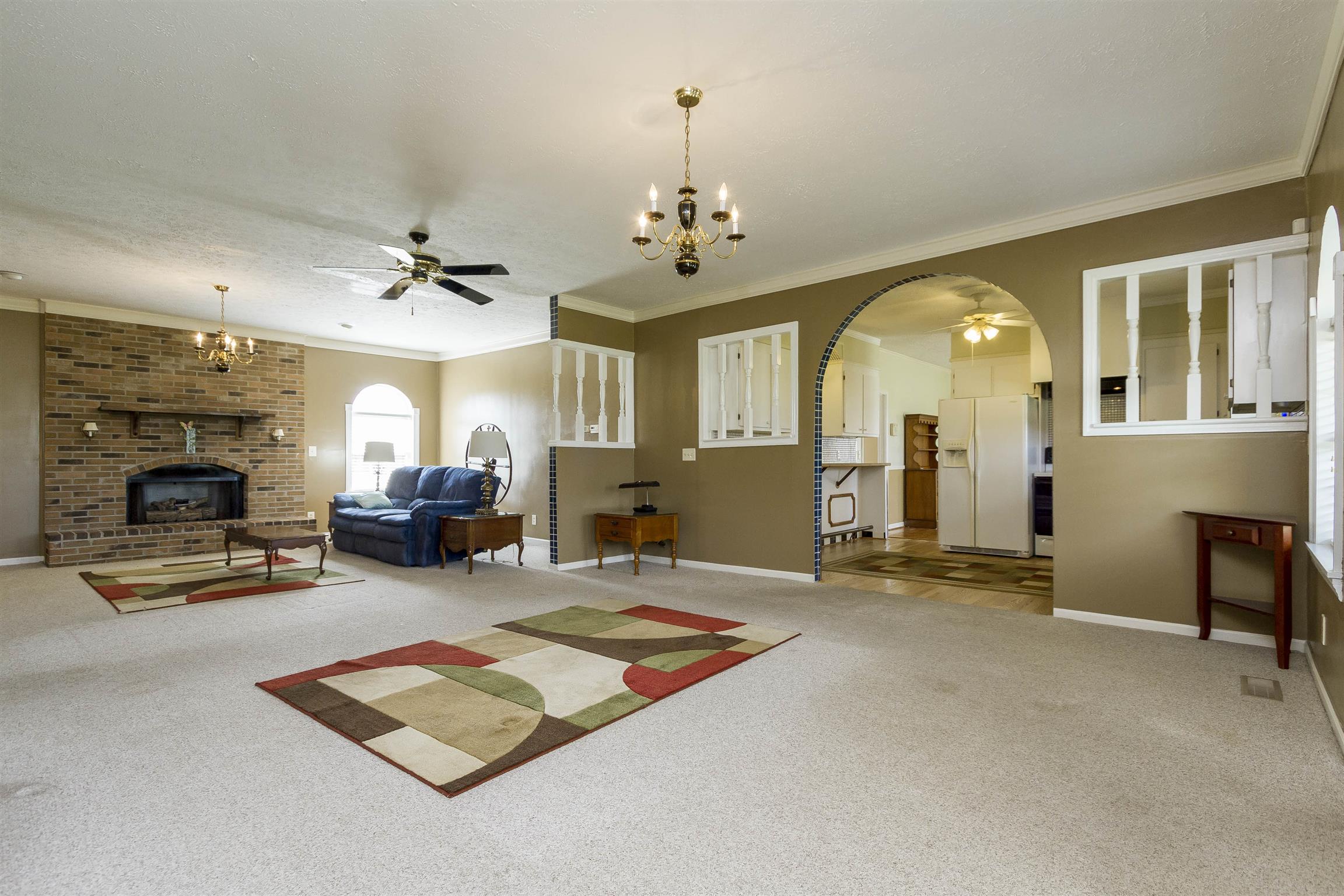 5067 Youngville Road Springfield, TN 37172 - Photo 5 of 28 a living room with furniture gym equipment and a fireplace