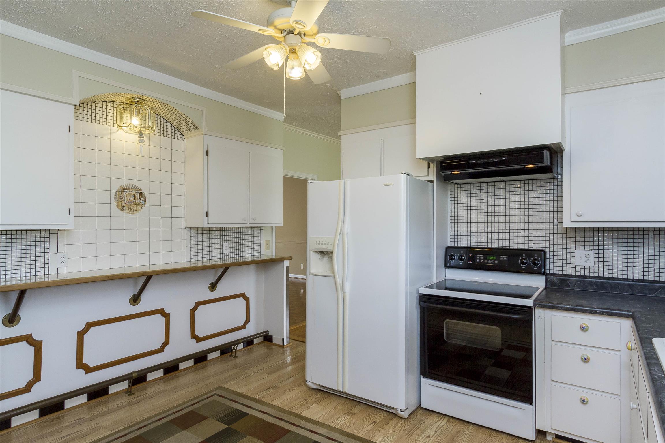 5067 Youngville Road Springfield, TN 37172 - Photo 7 of 28 a kitchen with a refrigerator and a stove top oven