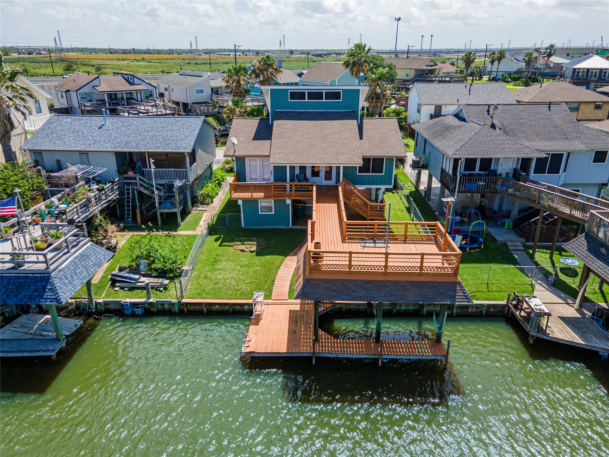 an aerial view of a house with swimming pool garden and patio