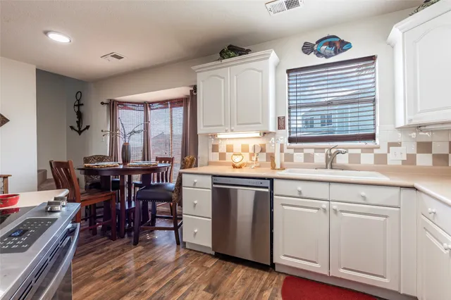 a bedroom with double bed and a flat screen tv
