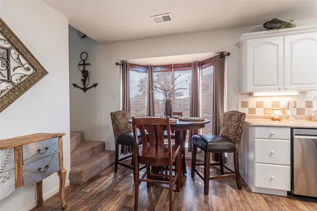 a spacious bathroom with a double vanity sink and a mirror